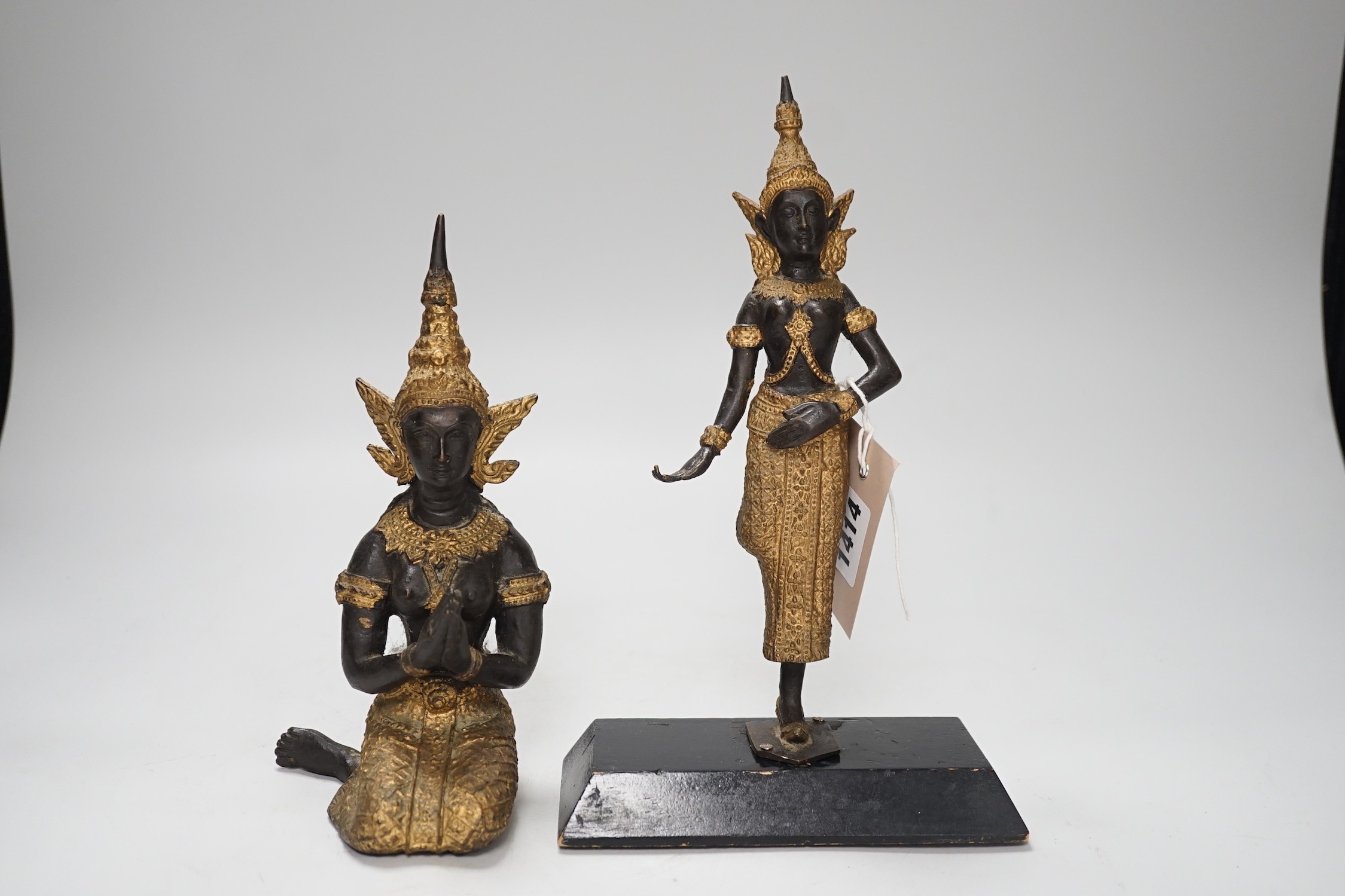 Two two colour Thai patinated metal figures and a hollow cast leopard. Tallest 25cm